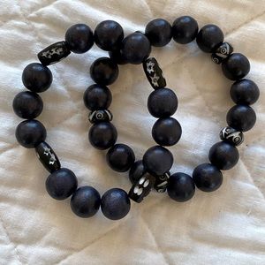 Black wooden bead bracelet with bone beads.